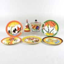 A Clarice Cliff style teapot, together with sugar sifter and five various plates (7) Overall