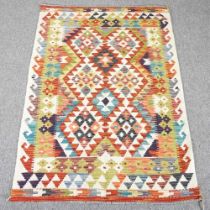 A kilim rug, with all over coloured diamonds, 155 x 100cm
