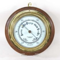 An early 20th century brass cased ship's barometer, signed John Barker & Co. Ltd, Kensington,
