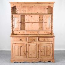 A modern pine dresser, on a plinth base 140w x 43d x 190h cm