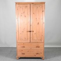 A modern pine double wardrobe, together with a pine cheval mirror (2) 95w x 57d x 188h cm
