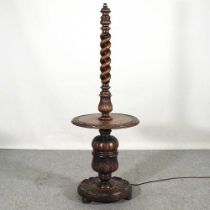 An early 20th century carved oak standard lamp, with a baluster column, 150cm high Overall solid and