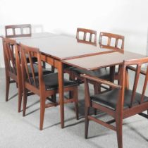 A mid 20th century Danish style hardwood extending dining table, together with a set of six dining