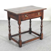 An 18th century oak side table, containing a single drawer, on turned legs 76w x 50d x 70h cm