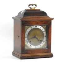 An early 20th century walnut cased mantel clock, with a twin train movement, stamped Imperial,