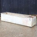 A large galvanised trough, 182cm wide