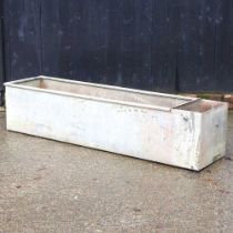 A large galvanised trough, 182cm wide