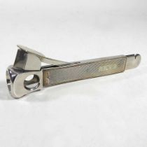 A modern silver cigar cutter, with engine turned decoration and engraved with initials J.H.W.,