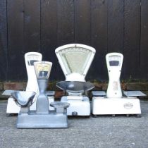 A pair of vintage shop scales, together with two others (2)