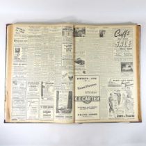 A collection of 1950's newspapers, bound in a large volume, 67cm high