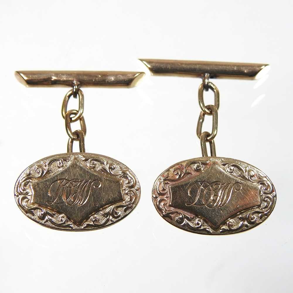 A pair of 9 carat gold cufflinks, of oval shape, engraved with initials, 7.7g, 21mm wide