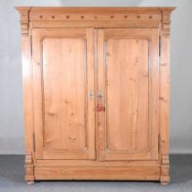 An antique pine French armoire, enclosed pair of a pair of panelled doors 170w x 64d x 195h cm