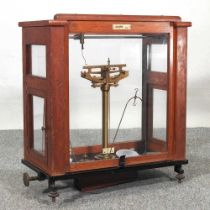 A set of mid 20th century scientific scales, cased, 44cm wide