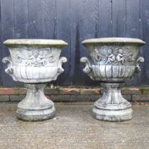 A pair of large cast stone garden urns, of pedestal shape, 70cm high