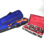 A Boosey & Hawkes Regent clarinet, cased, together with a Stentor Student I eleven inch violin, 46cm