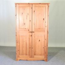 A modern pine double wardrobe, with panelled doors 100w x 176h x 57d cm