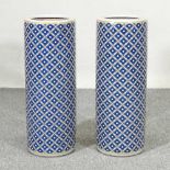 A pair of Chinese porcelain stick stands, with blue lattice decoration, 60cm high (2)