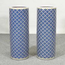 A pair of Chinese porcelain stick stands, with blue lattice decoration, 60cm high (2)