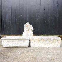 A reconstituted stone trough, together with another and a stone statue of a courting couple (3)