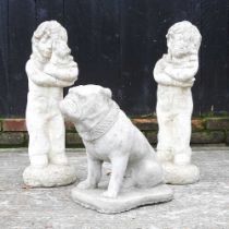 A cast stone garden statue of a bulldog, together with a pair of figures, highest 67cm (3)