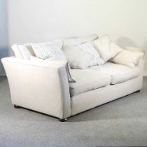 A modern cream upholstered sofa, with loose cushions 195w x 103d x 90h cm