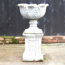 A cast stone garden urn, on a plinth base, 88cm high