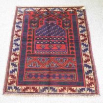 A Baluchi prayer rug, of geometric design, 134 x 83cm