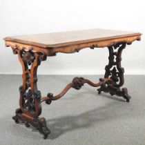 An ornate Victorian burr walnut centre table, on a carved trestle base 118w x 58d x 72h cm