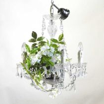 A modern glass chandelier, 50cm diameter, with faux plant decoration