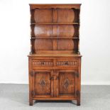 A mid 20th century carved oak dresser, by Bevan Funnell 92w x 45d x 175h cm