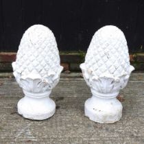 A pair of cast stone pineapple gate post finials, 60cm high