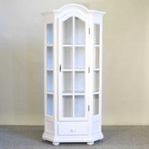 A white painted glazed cabinet, with a drawer below 89w x 39d x 88h cm