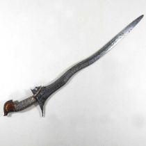 A 19th century Eastern kris, having a bound wooden grip and engraved wavy blade, 52cm long Overall