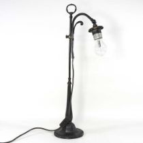 A mid 20th century bronzed adjustable desk lamp, 65cm high