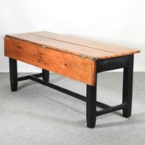 A 19th century dining table, with a hinged pine plank top, on a painted base 181w x 88d x 77h cm