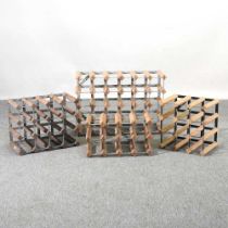 A collection of four wine racks, largest 63cm wide (4)