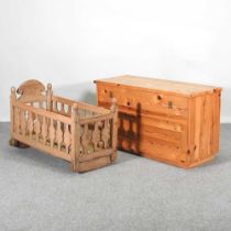 A pine cradle, together with a stained pine box, 106cm wide (2)