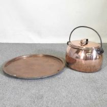 A 19th century copper cauldron, with an iron handle, together with a large tray, 63cm wide (2)