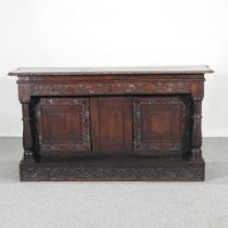 An 18th century and later carved oak sideboard, on a plinth base 151w x 42d x 84h cm