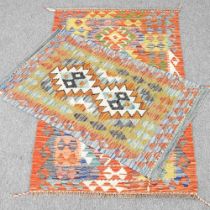 A kilim rug, 132 x 86cm, together with another, 100 x 62cm (2)