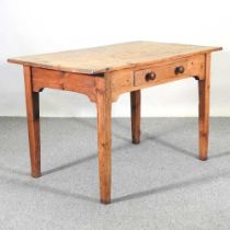 An antique pine dining table, containing a single drawer, on turned legs 122w x 72d x 77h cm