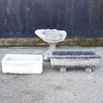 A reconstituted stone bird bath, 50cm high, together with two garden troughs (3)