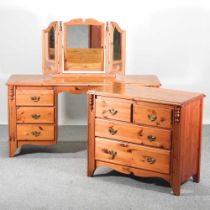 A pine chest of drawers, together with a matching dressing table, with mirror (2) 146w x 46d x 75h