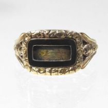 A George IV enamelled mourning ring, with a scrolled surround, inscribed to Polley November 1819,