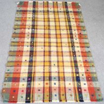 A woollen kilim, with all over coloured squares, 240 x 150cm