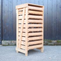 A wooden fruit store, with ten pull-out drawers 58w x 48d x 122h cm