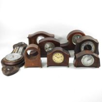 A collection of early 20th century mahogany cased mantel clocks and clock cases, together with a