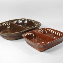 A slipware baking tray, 39cm wide, together with another smaller (2)