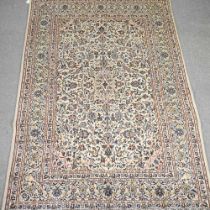 A Persian carpet, with all over foliate designs, on a cream ground, 295 x 200cm