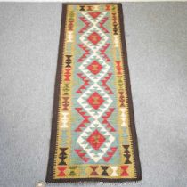 A kilim runner, with a central row of diamonds, 196 x 67cm